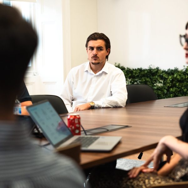 male member of staff in meeting